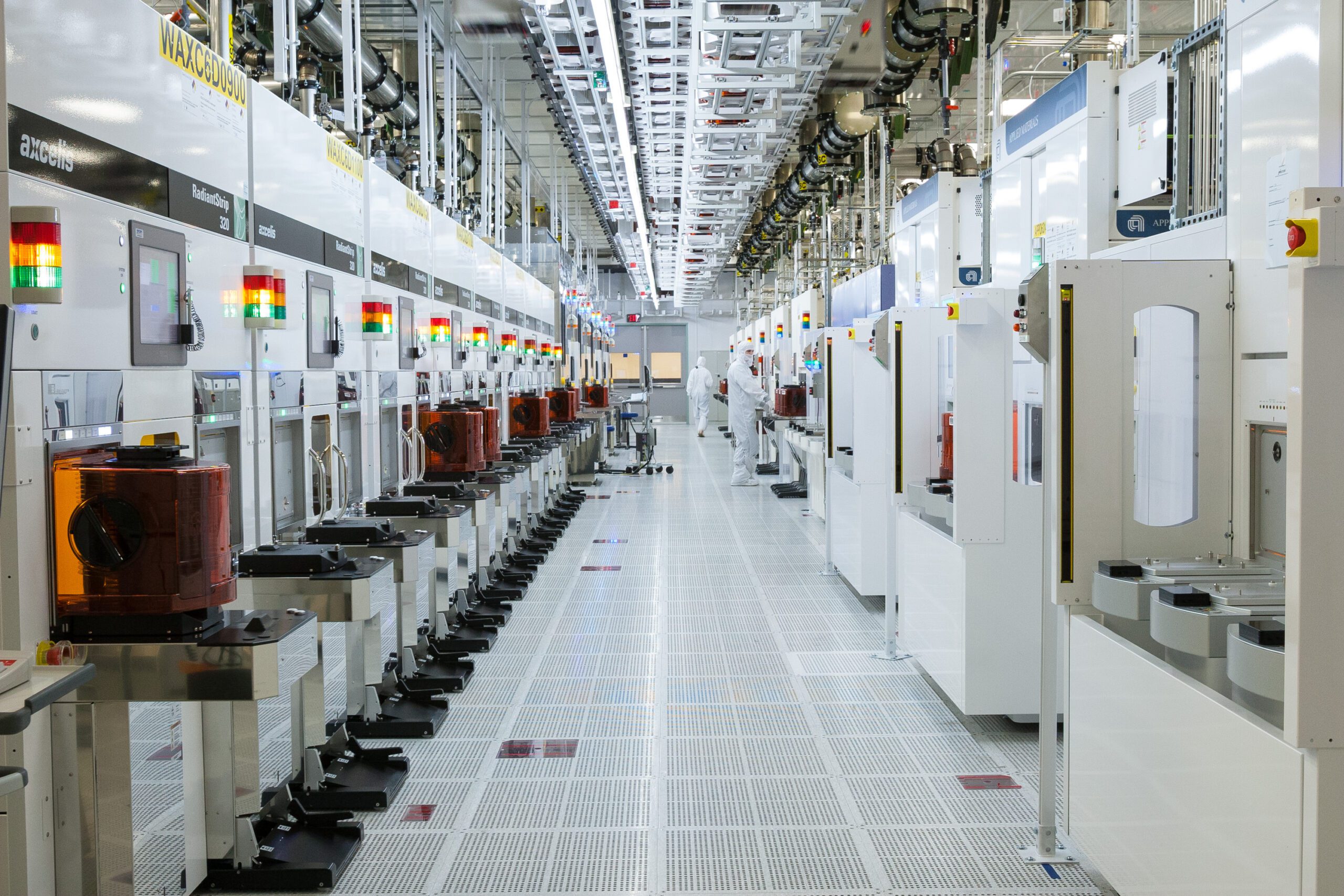 A high-tech semiconductor fabrication plant showcasing advanced machinery and clean room technology.