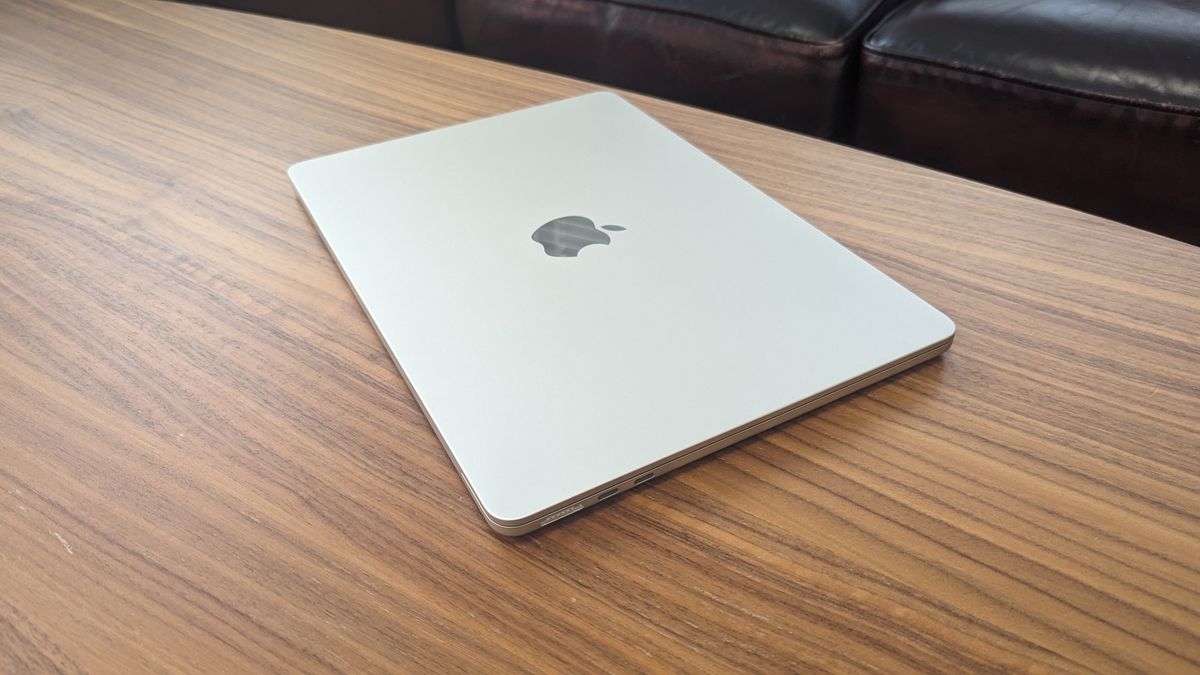 A modern and aesthetic setup featuring the new M4 MacBook Air on a stylish desk, with a vibrant interface and cozy accessories.