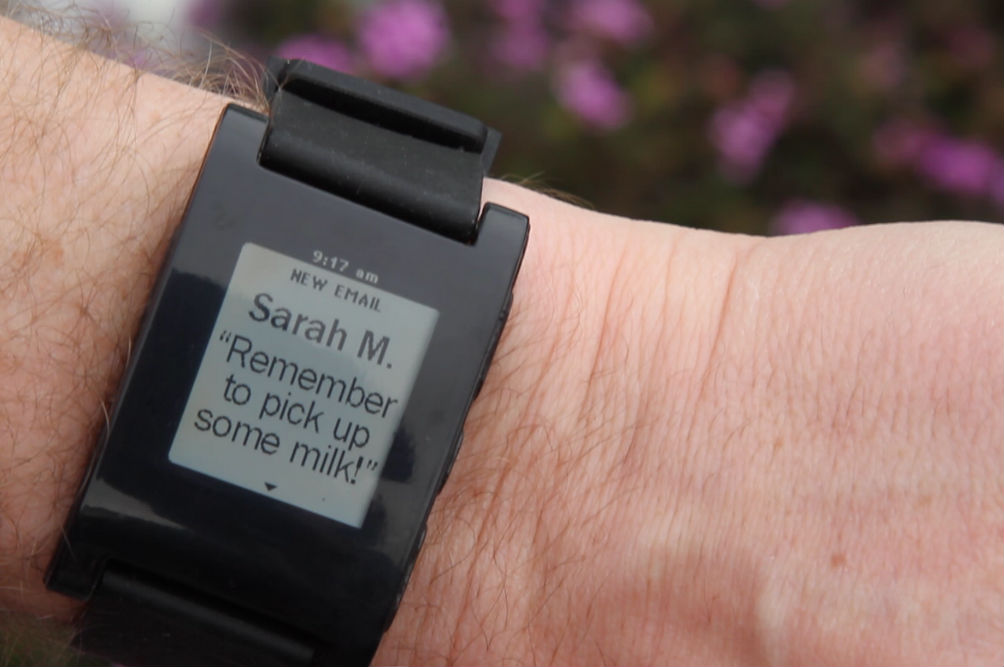 Stylized representation of the new Pebble smartwatch with physical buttons and retro design elements.