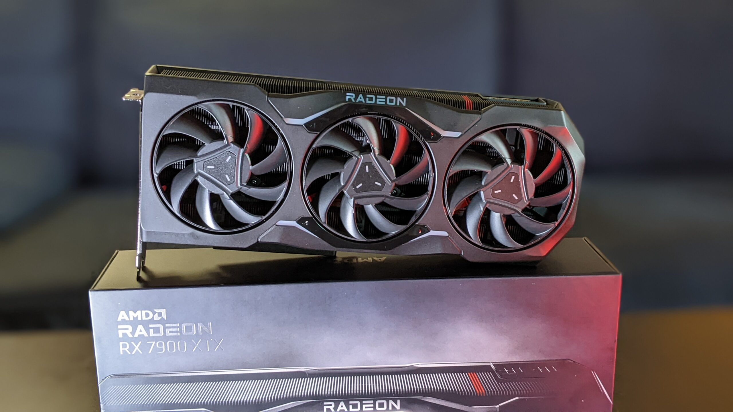 A visually striking representation of the AMD Radeon RX 7900 XTX graphics card surrounded by futuristic AI elements, showcasing enhanced performance.