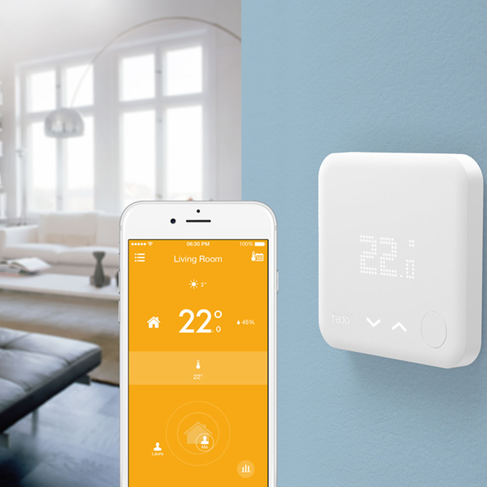 A modern living room showcasing Tado smart home devices and subscription details in a sleek, minimalist design.