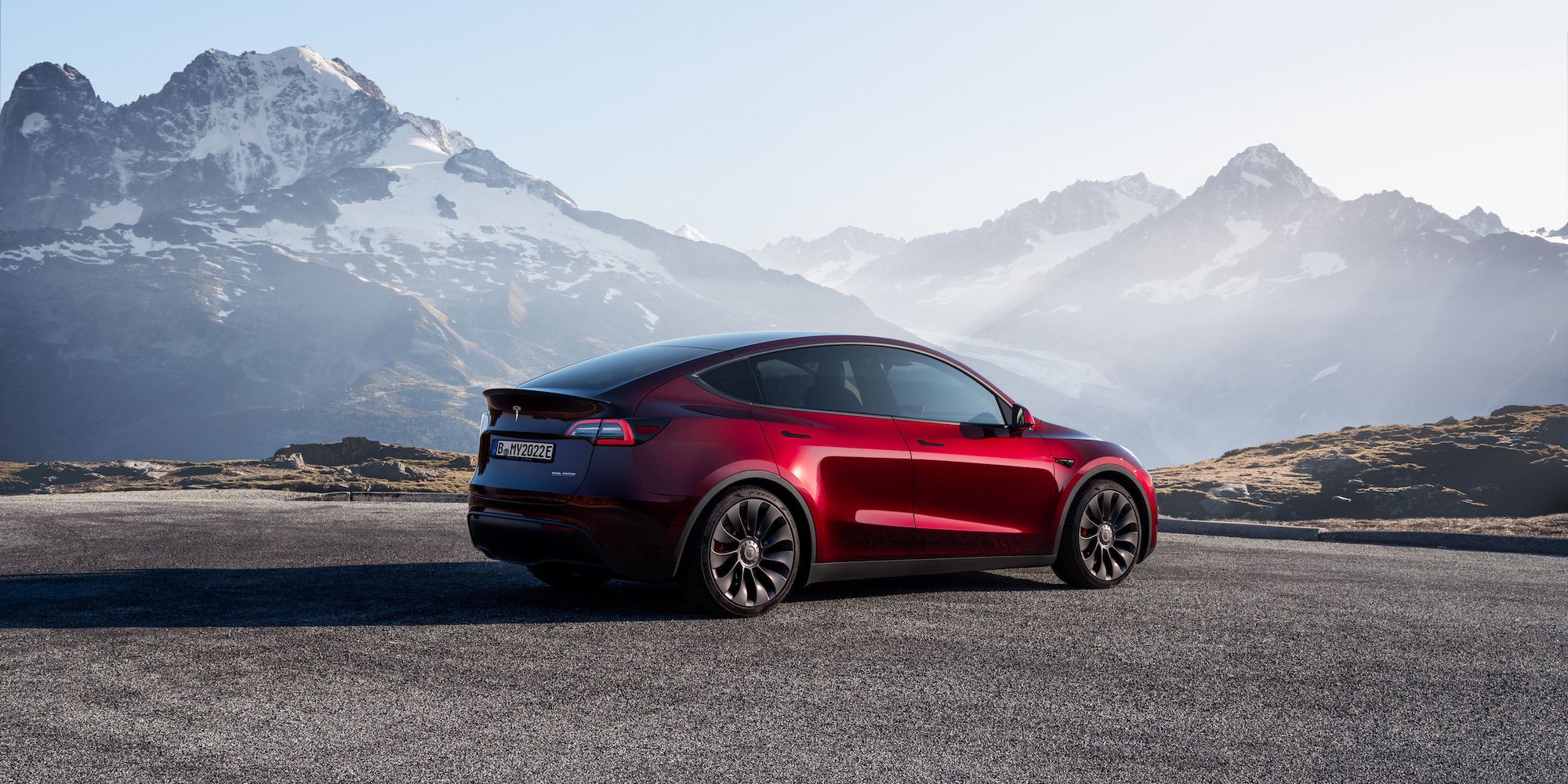 Futuristic Tesla Model Y Juniper showcasing its advanced 7-seat configuration in an urban environment.