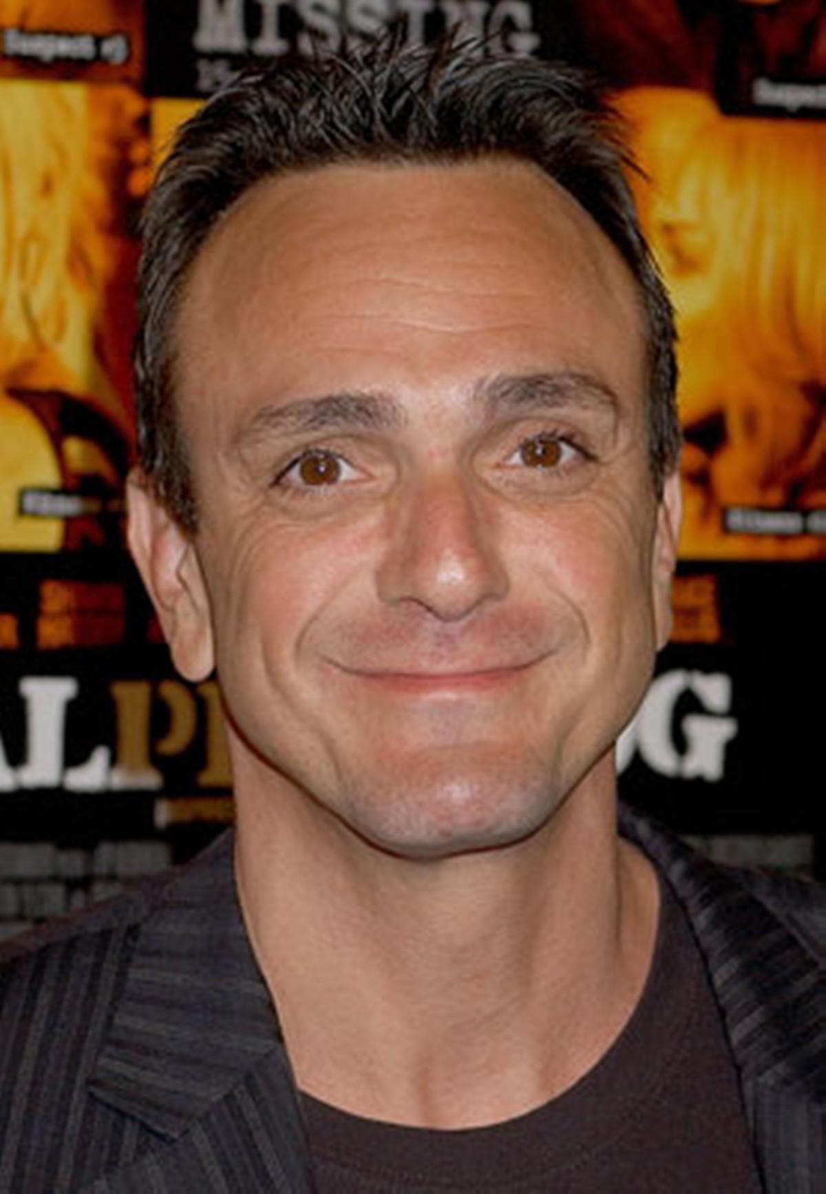 An artistic depiction of Hank Azaria reflecting on AI and voice acting in a colorful, cartoonish setting inspired by The Simpsons.